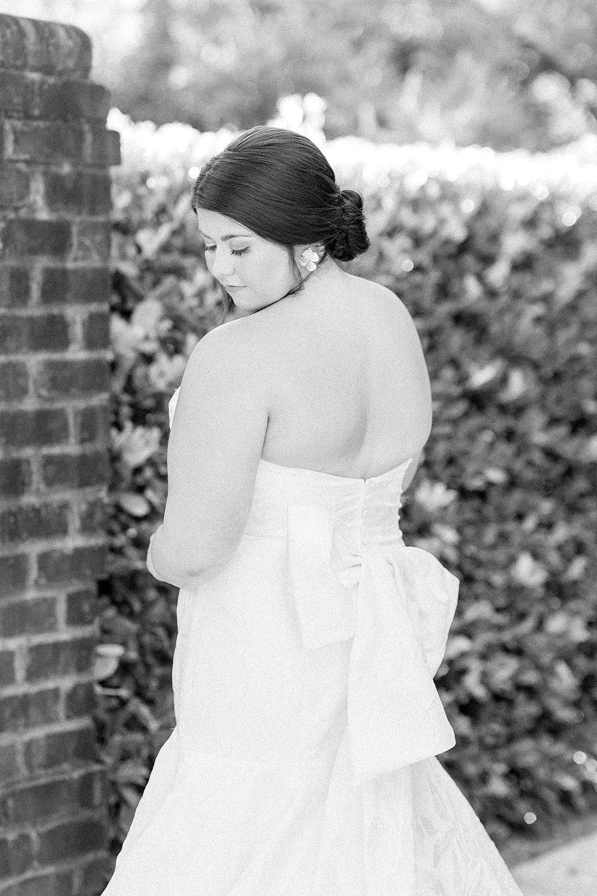 Classy and elegant wedding imagery featuring a Wedding Gown with a bow on the back