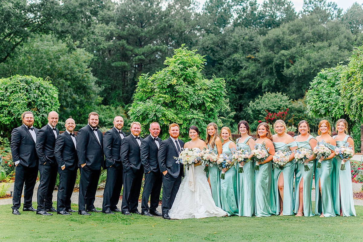 sage green, pink, cream, gold, and blue southern summer bridal party photos in north carolina