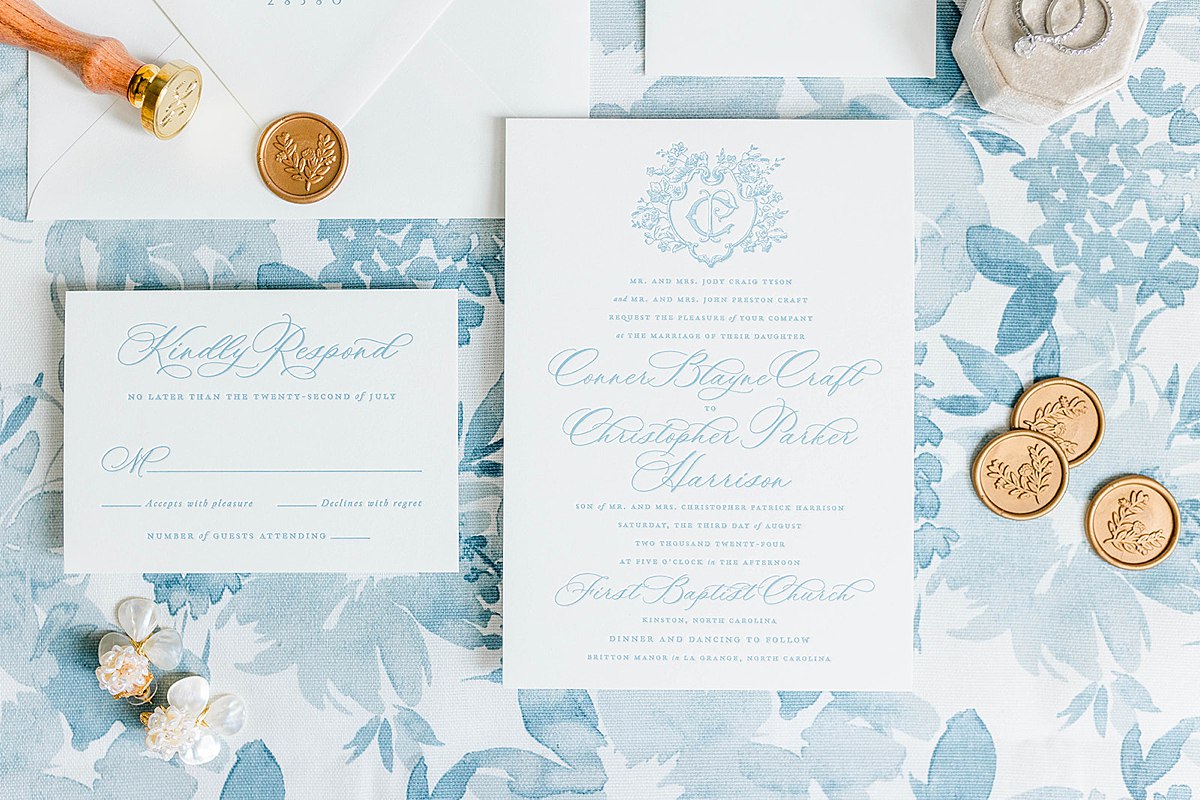 Blue and white wedding stationary including custom wedding crest for classic southern wedding