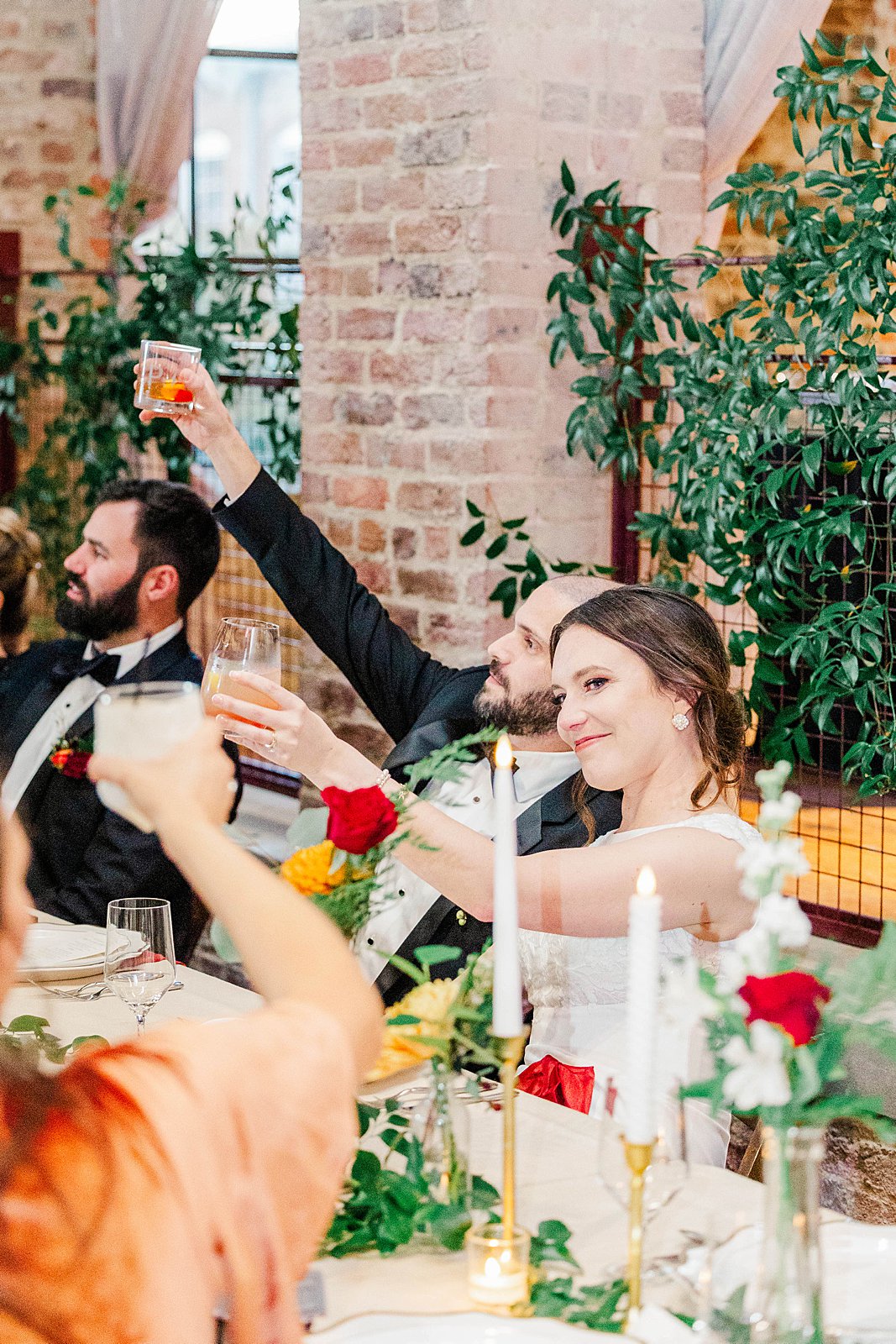 Bride raises a glass for a toast at The Powell House wedding | Kelsie Zeagler Photography