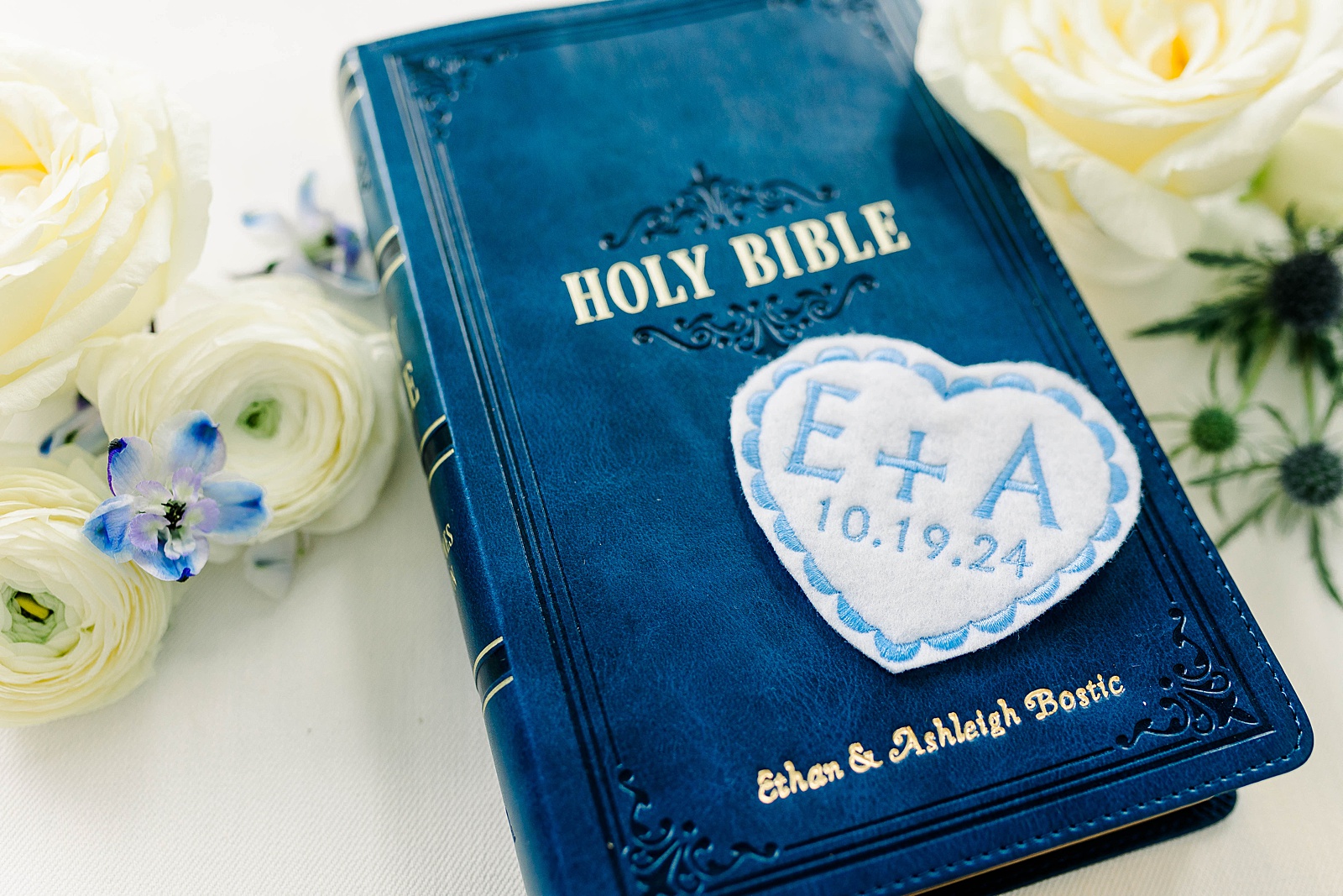 Custom designed Bible and patch details for a white and blue fall wedding at The English Country Barn by Kelsie Zeagler Photography. 