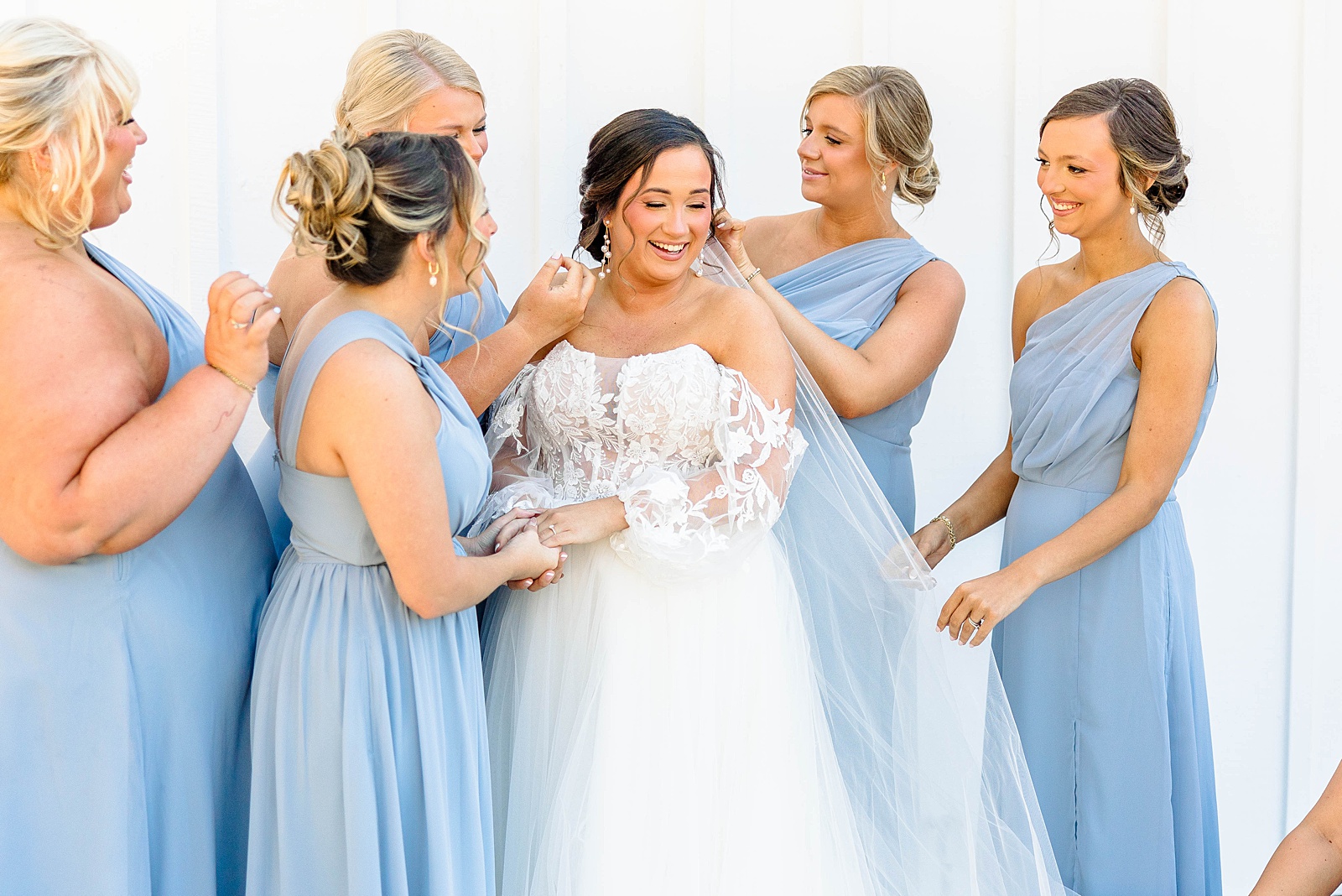 Bridesmaids dusty blue dresses for a fall wedding in North Carolina. 