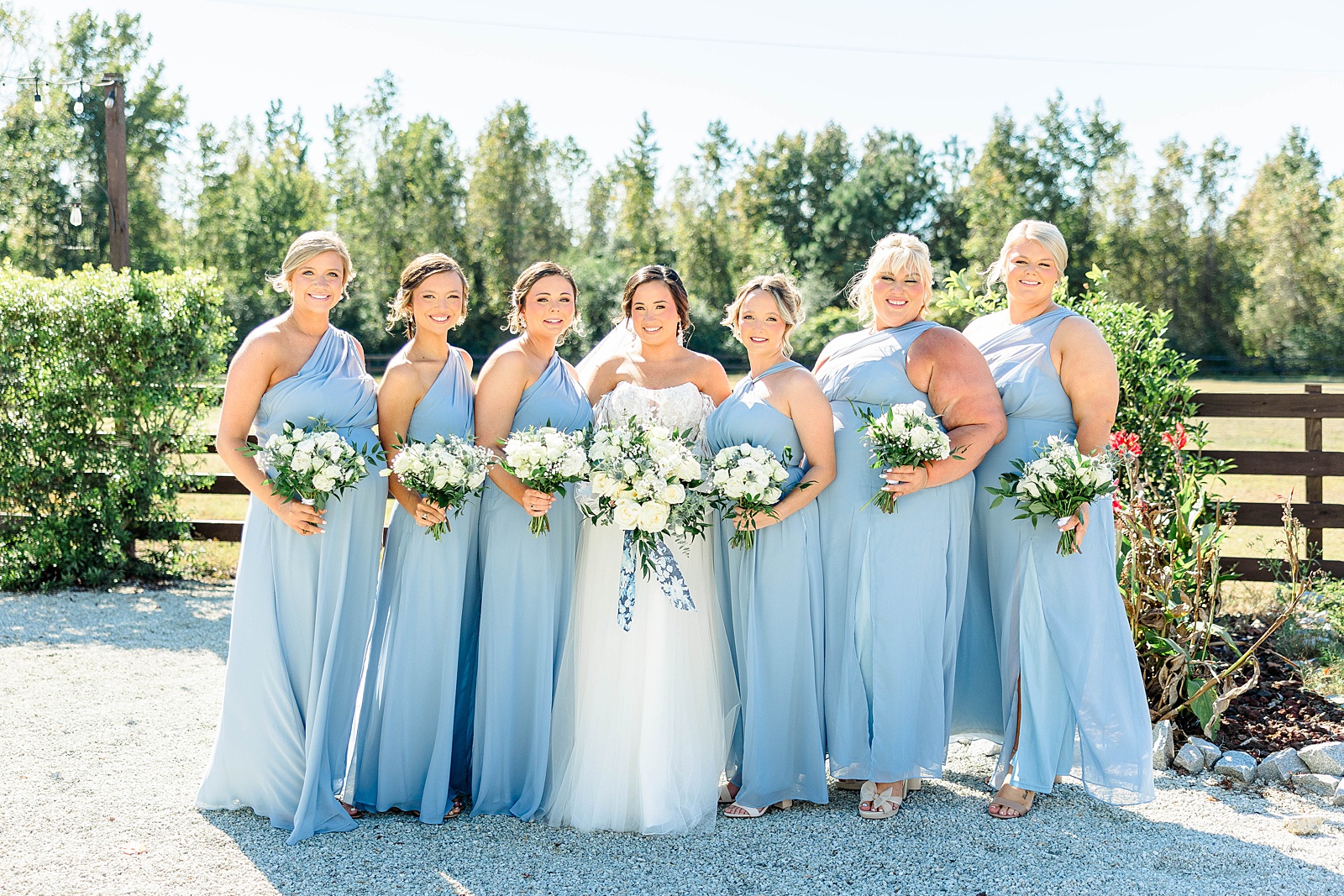 Bridesmaids portrait at The English Country Barn for blue and white fall wedding. 