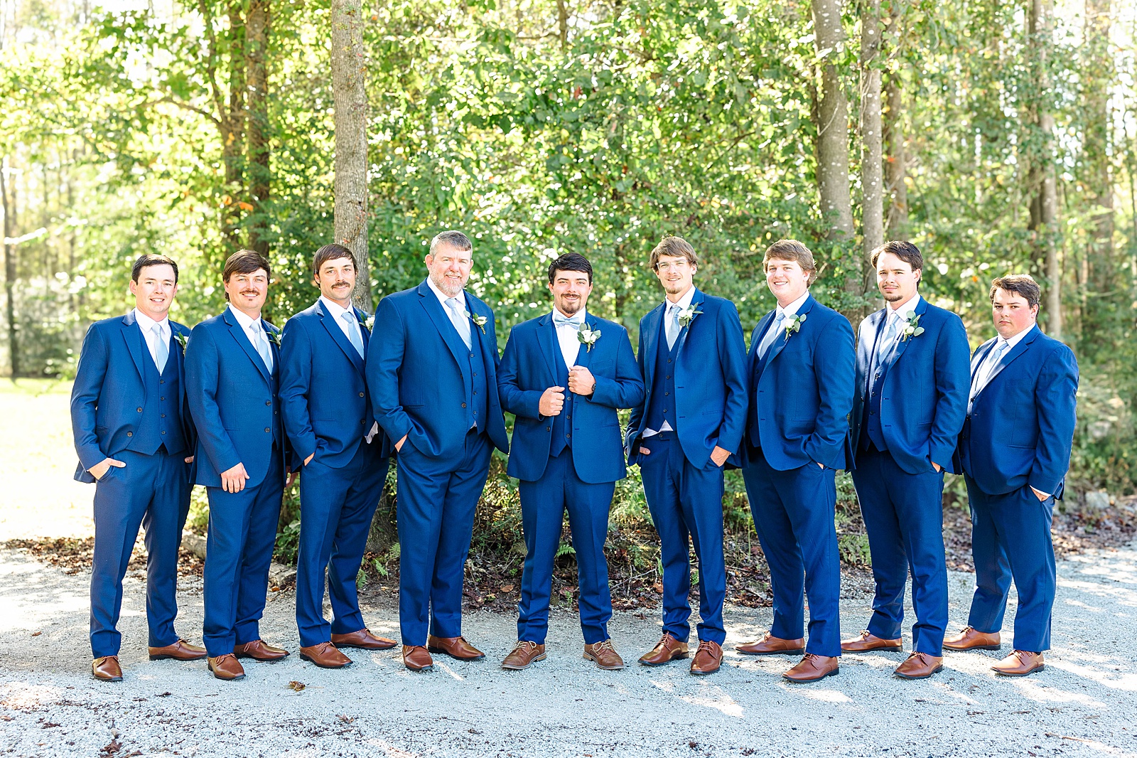 Blue suited groomsmen with brown shoes at The English Country Barn Wedding venue. 