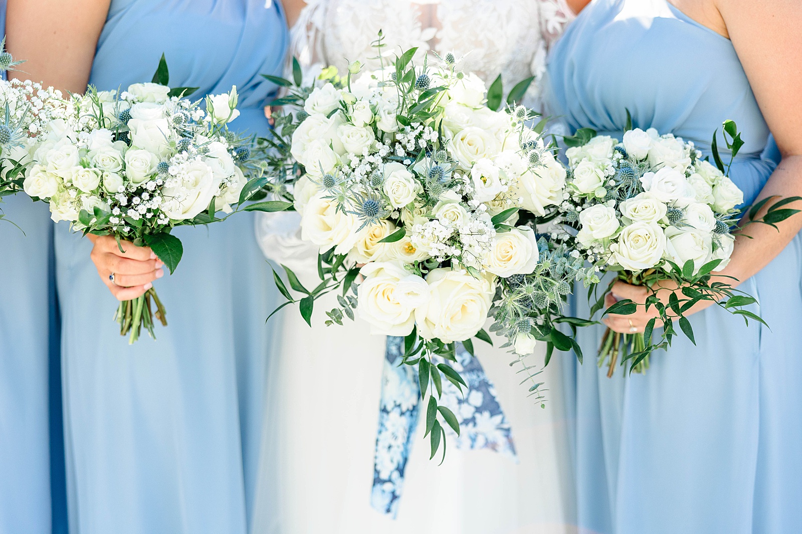 White rose and Blue thistle bouquet for a fall white and dusty blue wedding. 