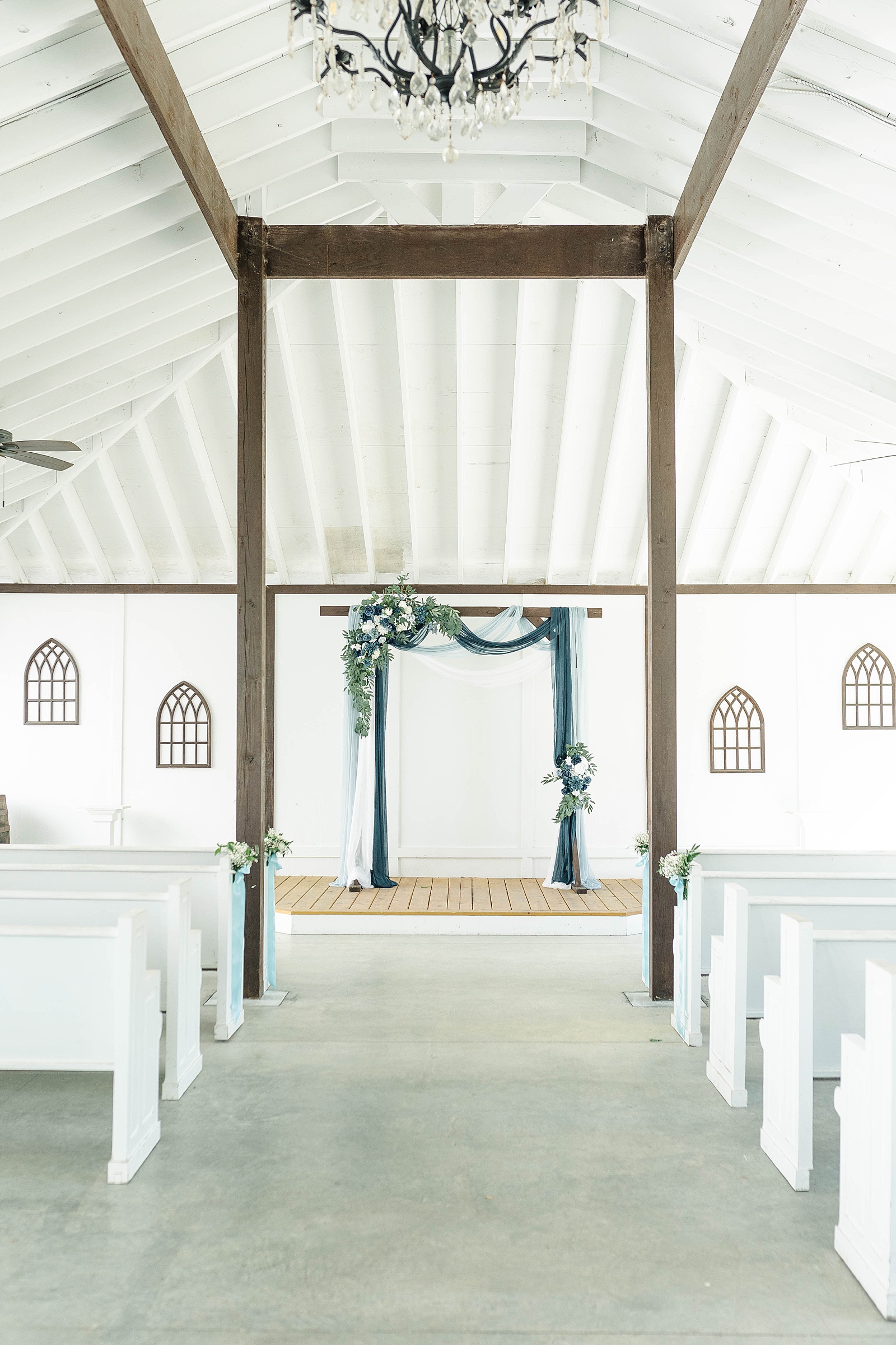 Ceremony space for a fall blue and white wedding at The English Country Barn. 
