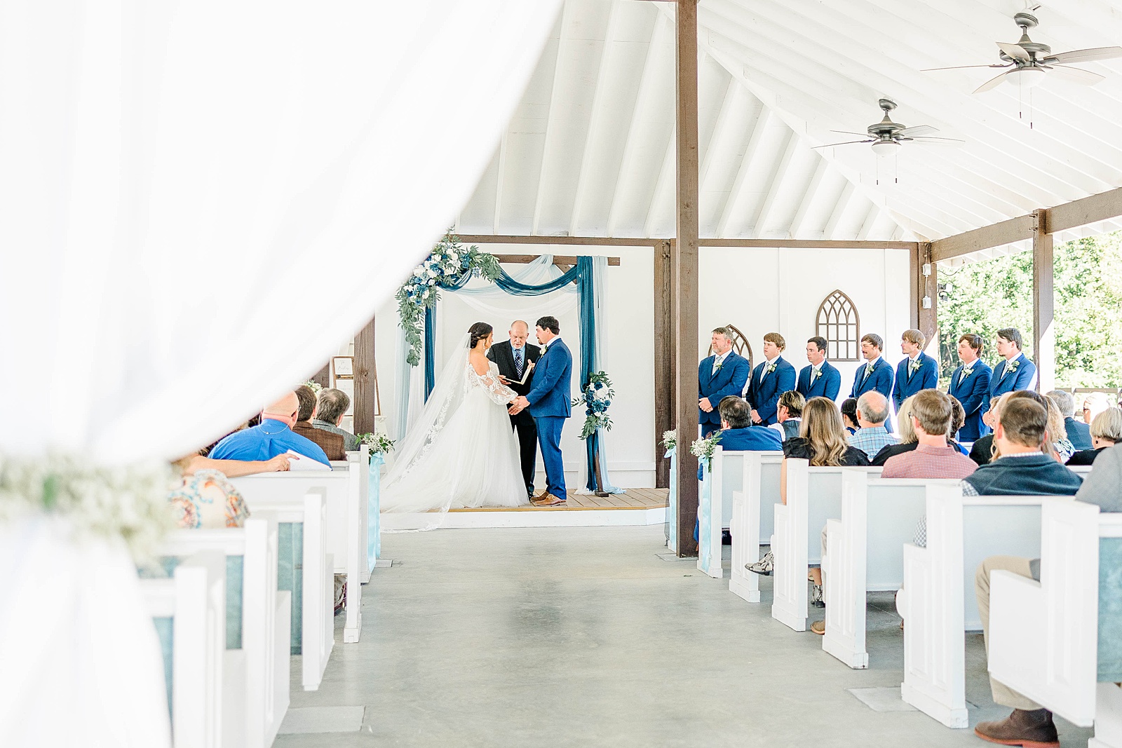 Blue and white wedding ceremony at The English Country Barn in North Carolina. 