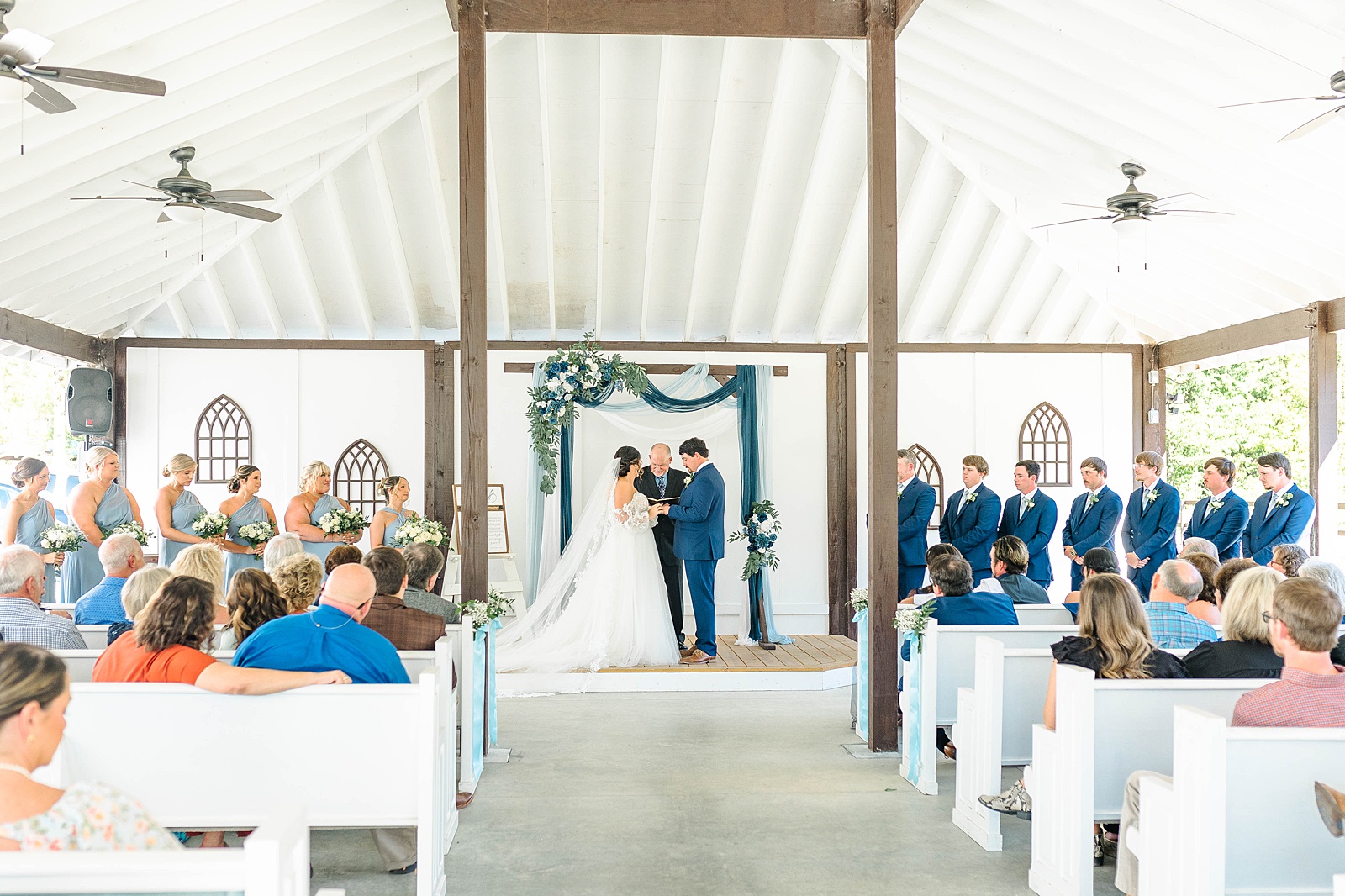 Blue and white wedding ceremony at The English Country Barn in North Carolina. 