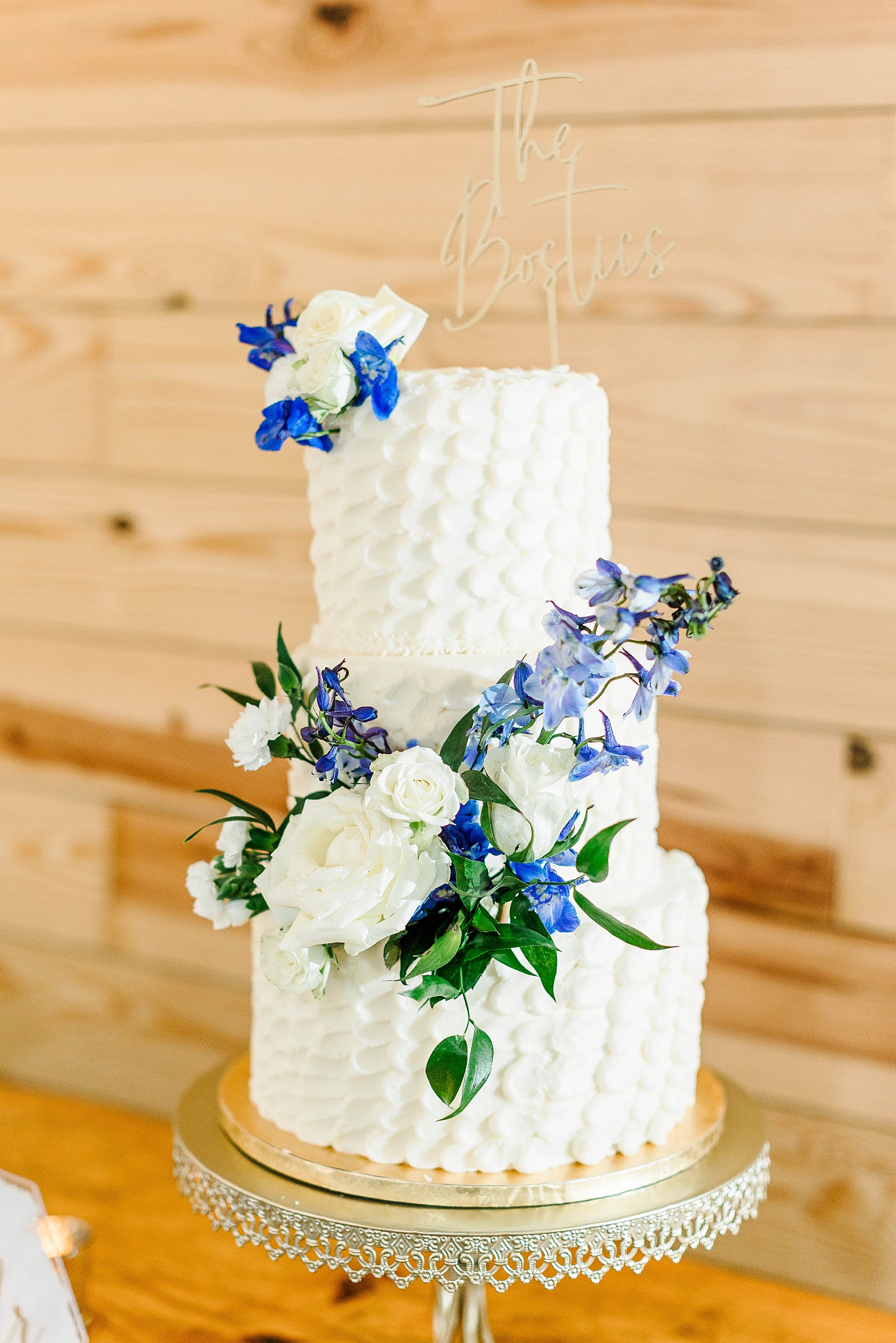 Floral decorations for a wedding cake. A blue and white wedding reception 