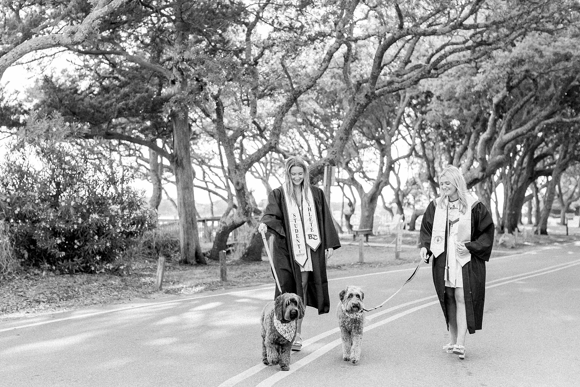 Friends with their dogs for senior photos in Beaufort NC