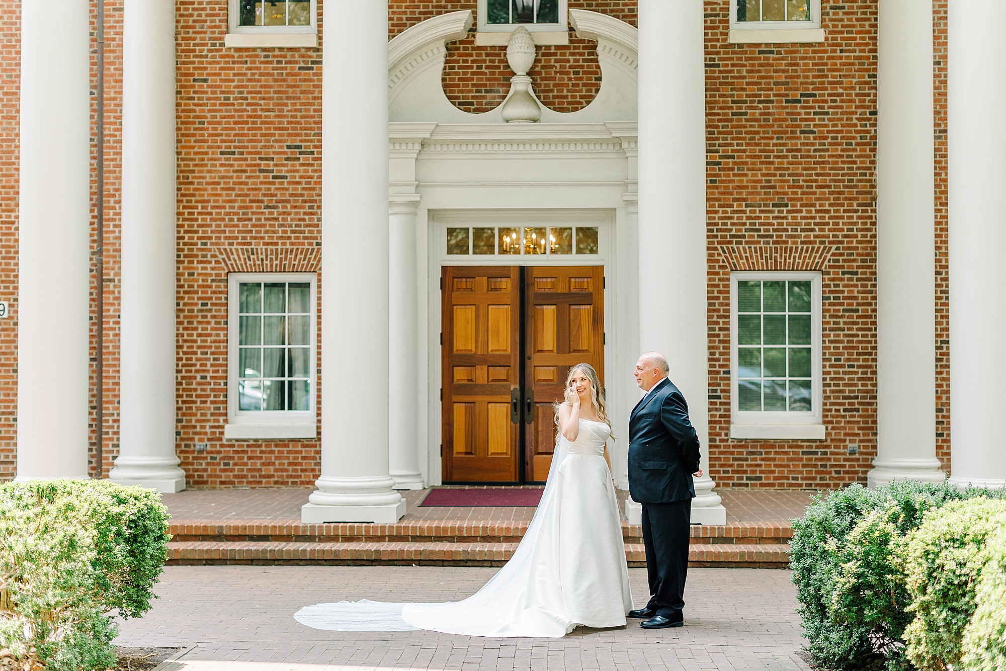 Bride and her dad outside of the chapel at Meredith College