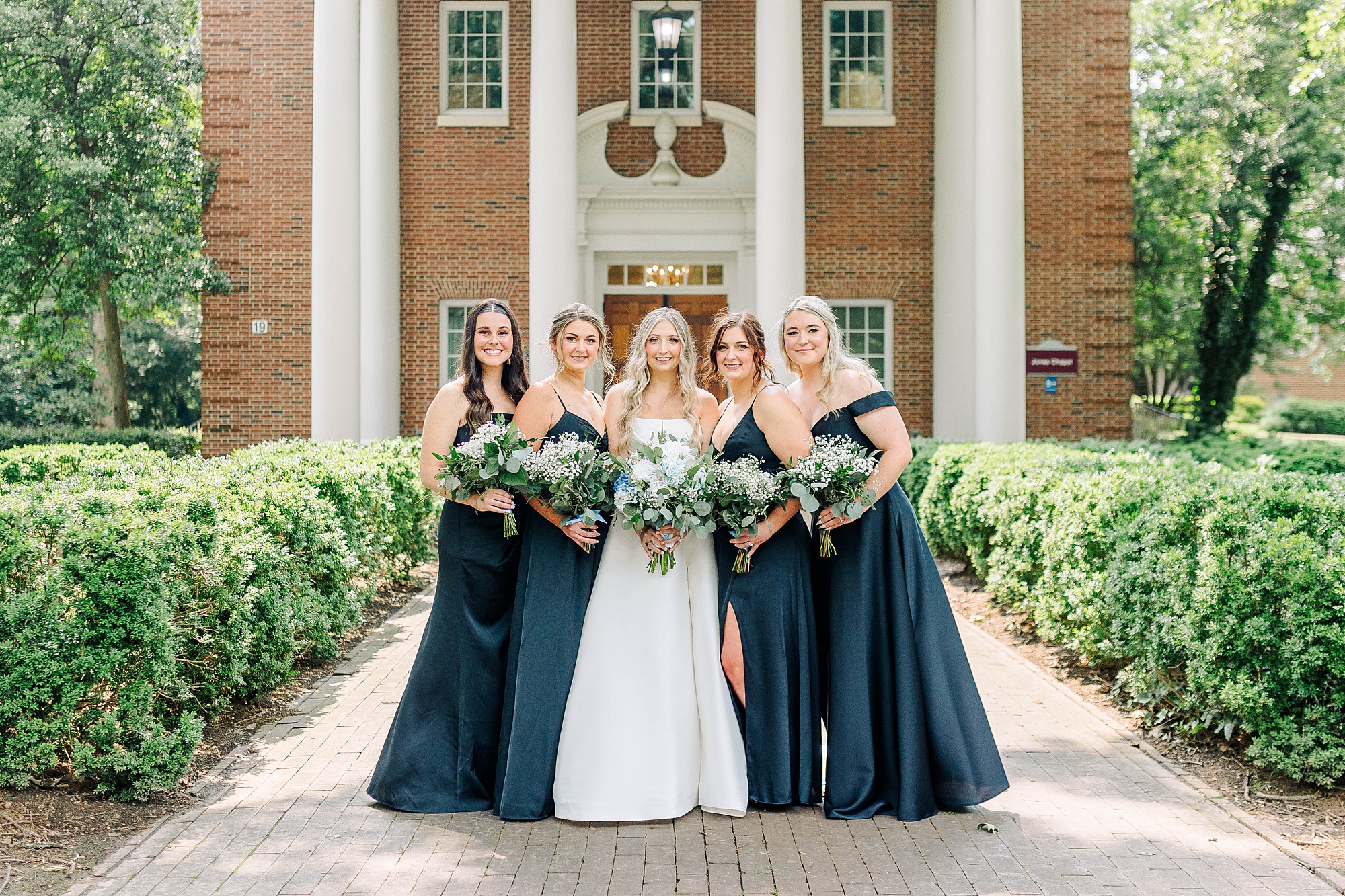 Bridesmaids in black dresses at Meredith College Chapel