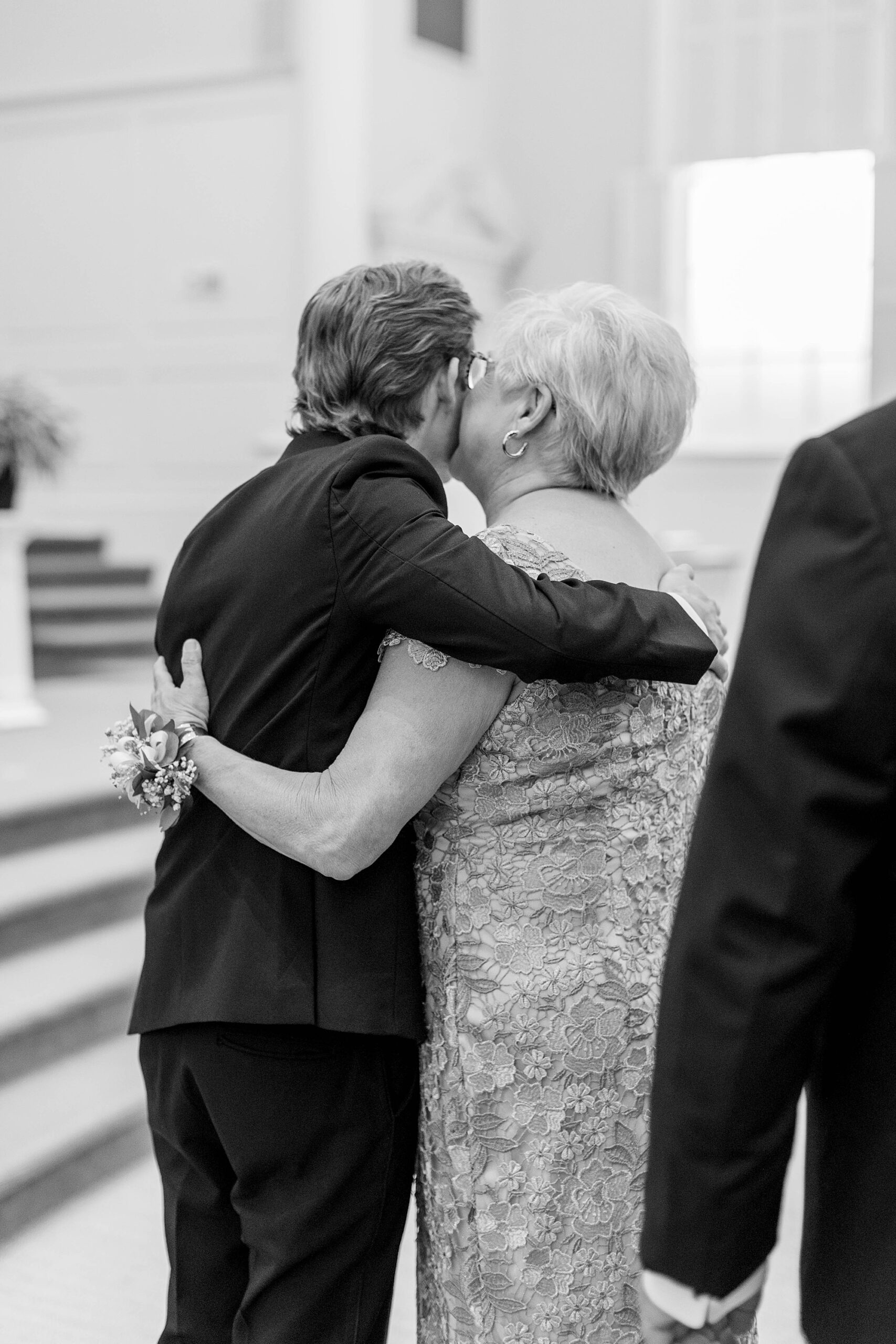 Mom kisses groom at wedding at Meredith College
