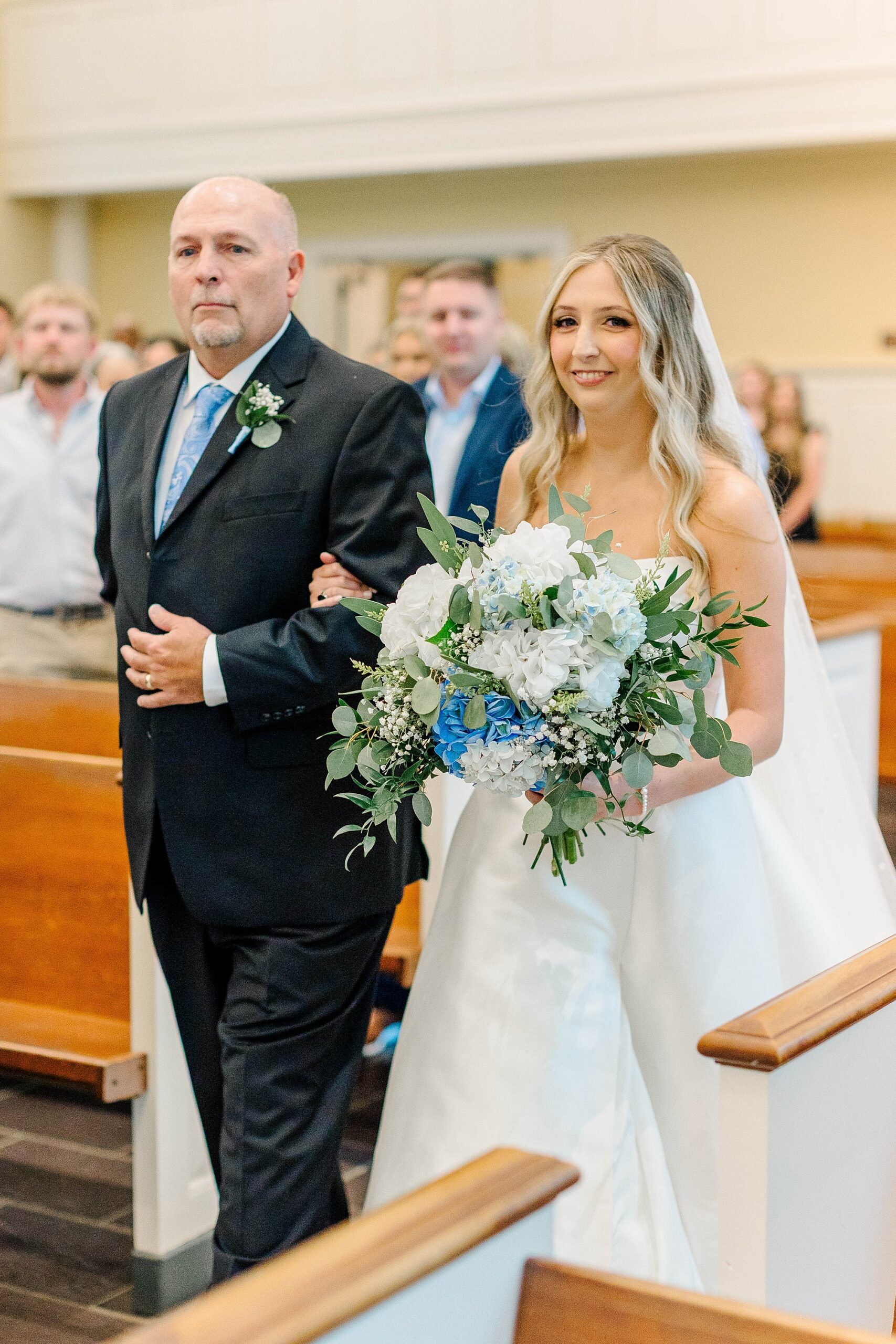 Bride and dad walk down the aisle at Meredith Chapel