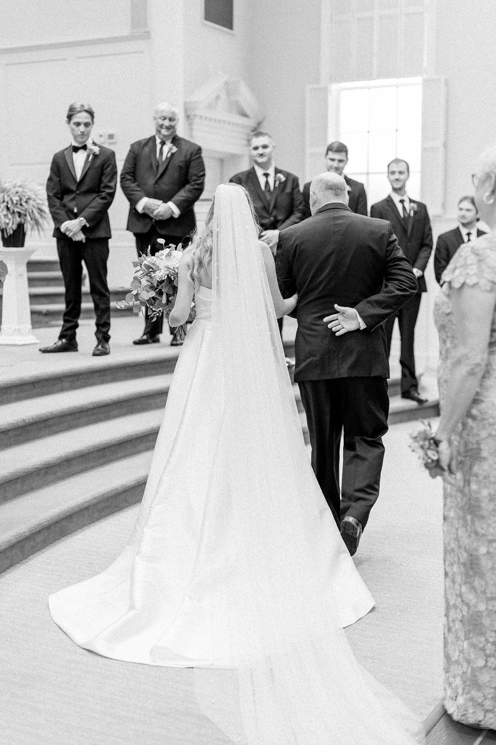 Dad walks bride down the Meredith College Chapel aisle