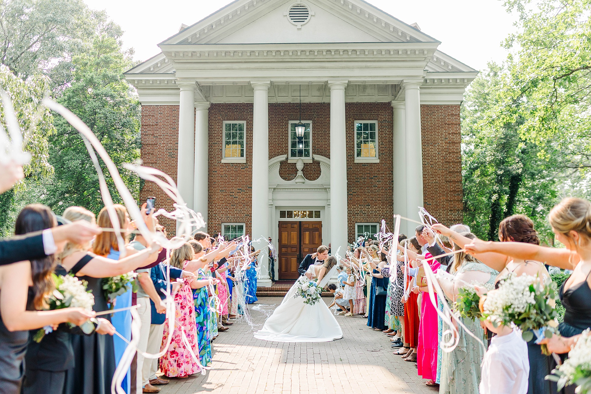 Daytime ribbon exit out of the Meredith College Chapel for wedding ceremony