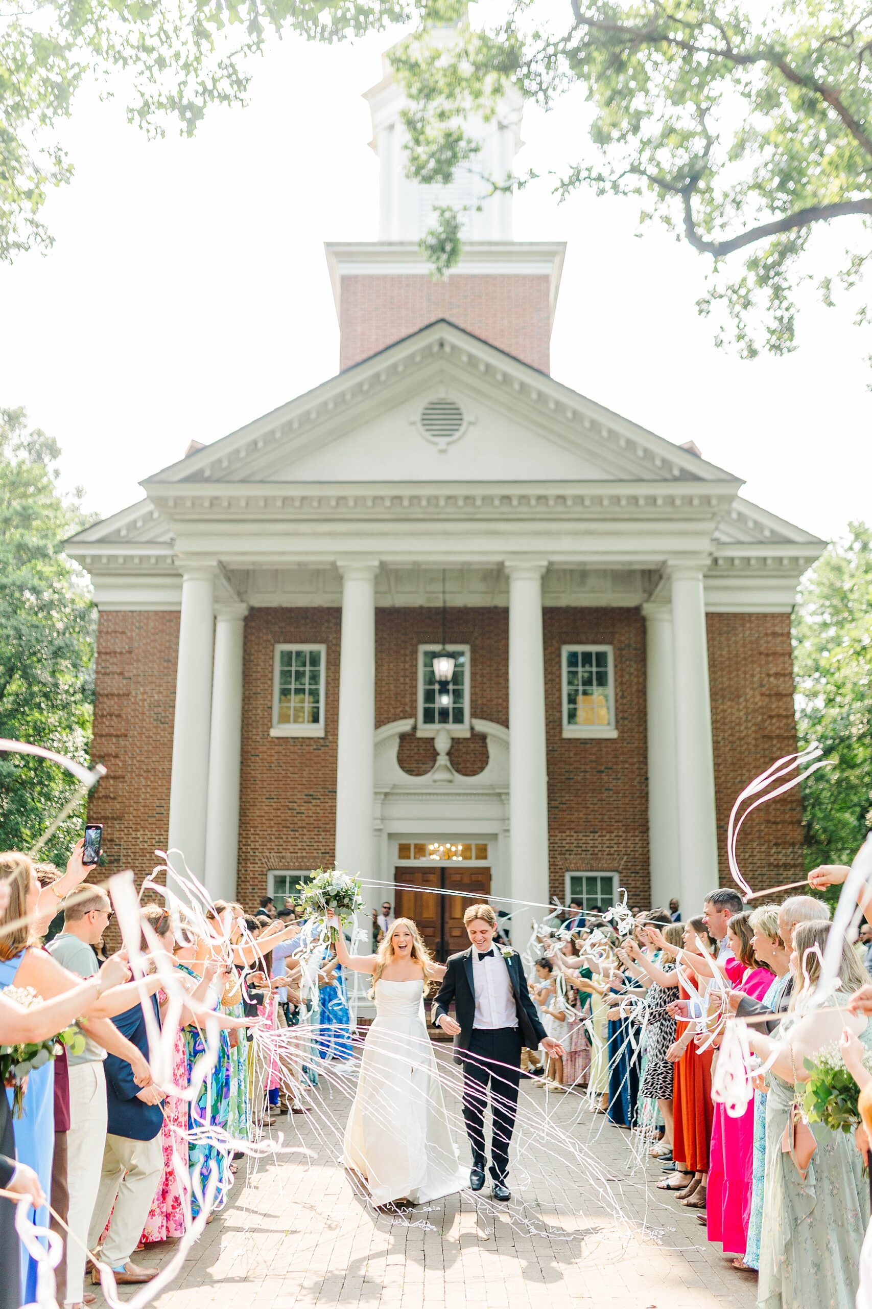 Alternative sparkler exit with ribbons out of the Meredith College Chapel for wedding ceremony
