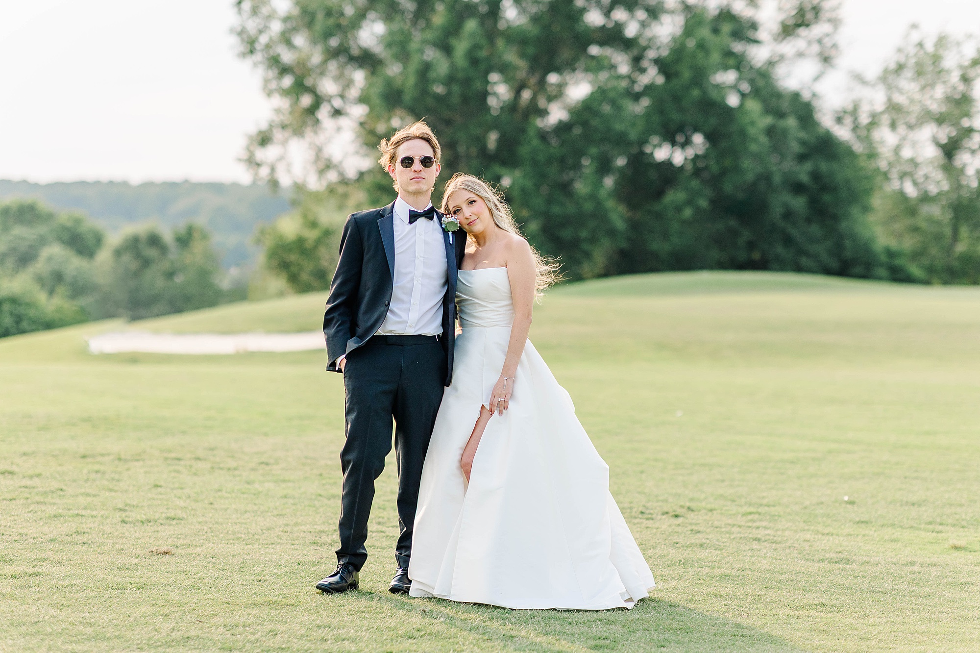 Newly married couple portraits on golf course in Raleigh NC