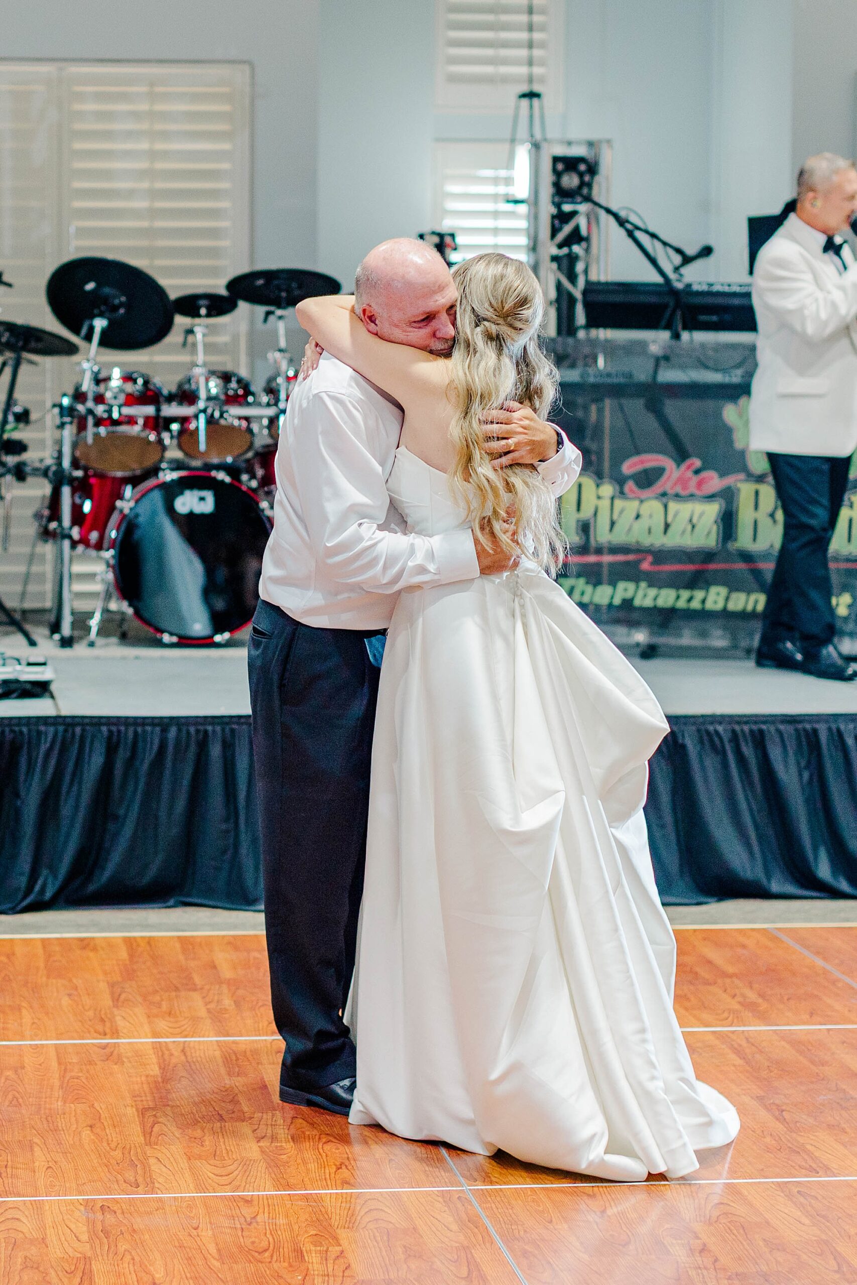 Bride dancing with her dad at wedding reception