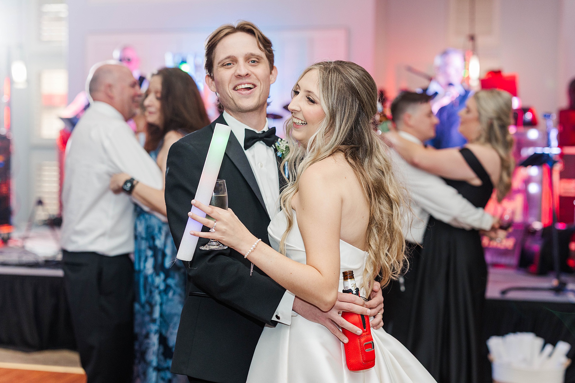 Bride and groom dancing at NC State Alumni building wedding reception
