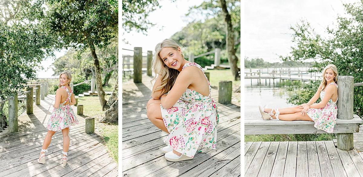 Senior girl in a floral, cross back dress with white strappy wedges during her coastal senior session in Beaufort, NC.