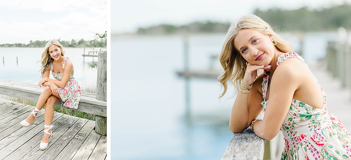 Senior girl in a floral, cross back dress with white strappy wedges during her coastal senior session in Beaufort, NC.